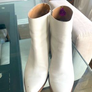 White leather shirt cowboy style but modern heel boots.